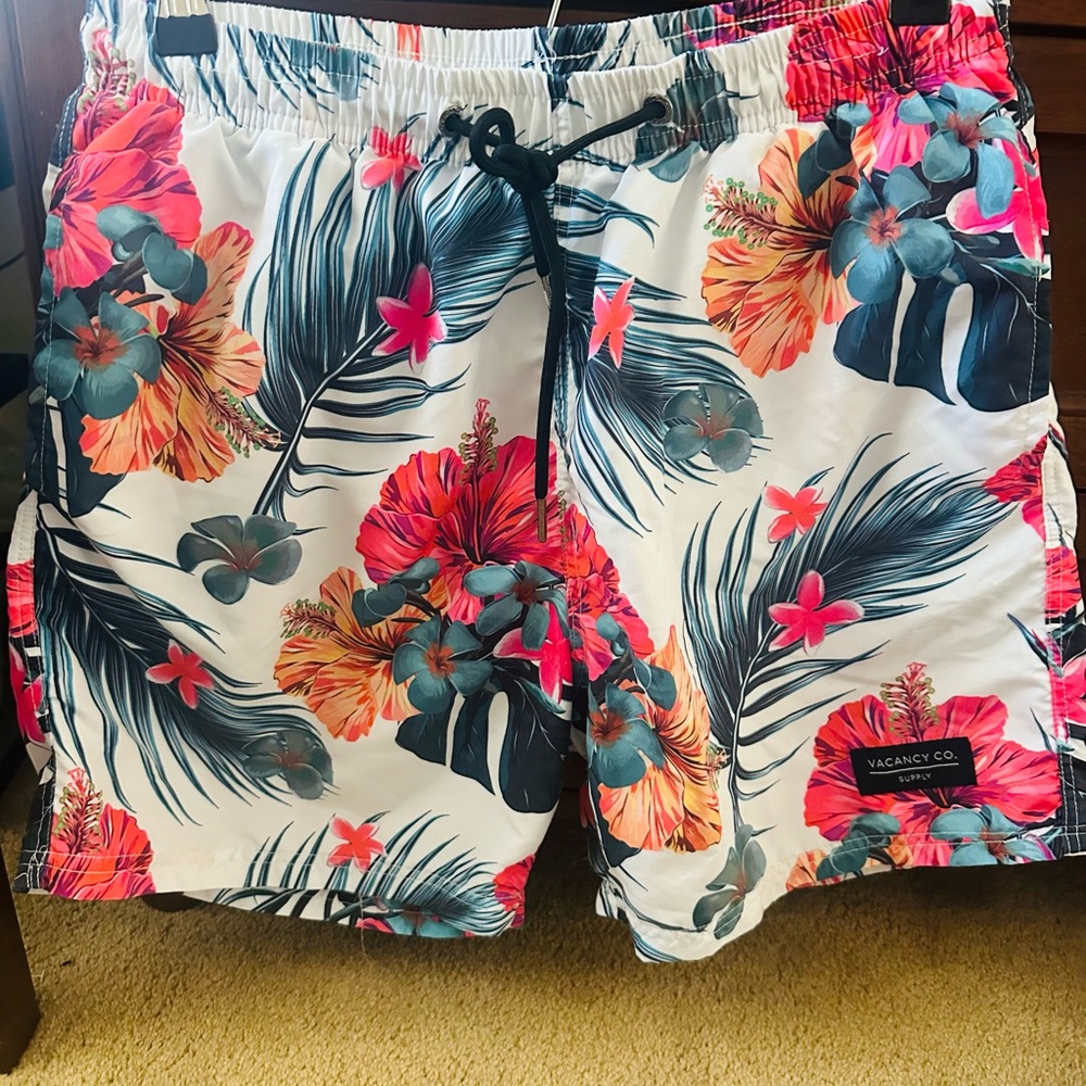 White and Red Board Shorts with Tropical Floral Design